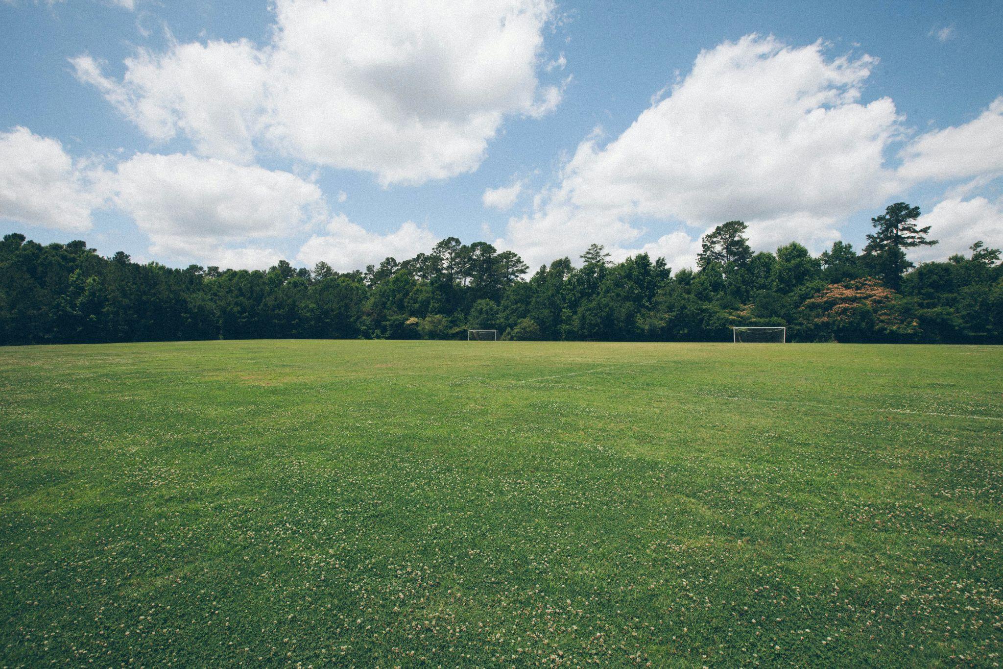 A large green field showcases the results of bi-weekly lawn maintenance in Central Valley.